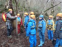 Assistant briefing a gorge walking group
